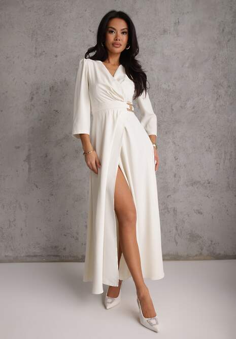 Jasnobeżowa Elegancka Sukienka o Kopertowym Kroju Zdobiona Aplikacją w Talii Zilendra