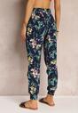 Pantaloni albaștri cu elastic în talie și la baza piciorului cu model floral Stesine