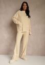 Jasnobeżowy Komplet Dzianinowy Sweter i Spodnie o Szerokim Kroju Ozdobione Lamówką Wedara