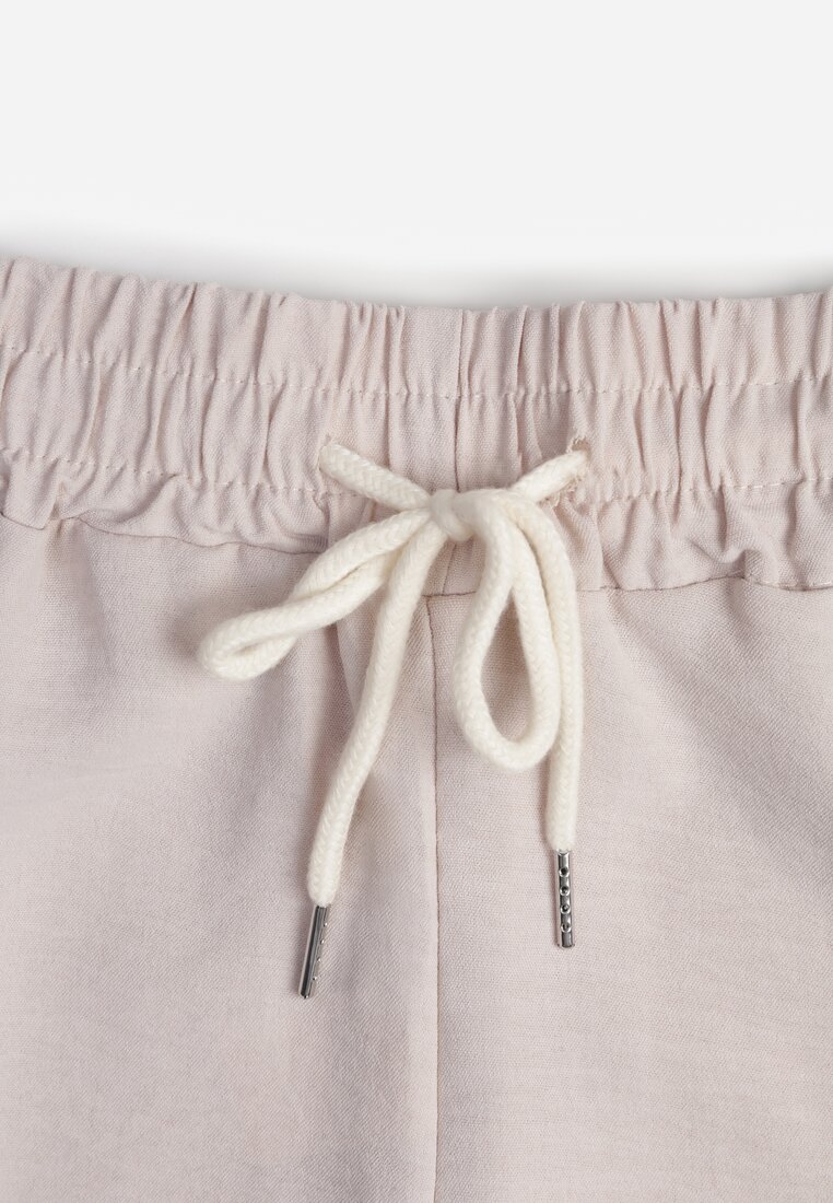 Pantaloni bej deschis cu talie înaltă și șnur în talie și picior drept Raveann
