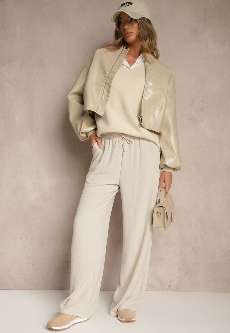 Pantaloni bej largi cu picioare ample cu lanț în loc de cordon Ostaria