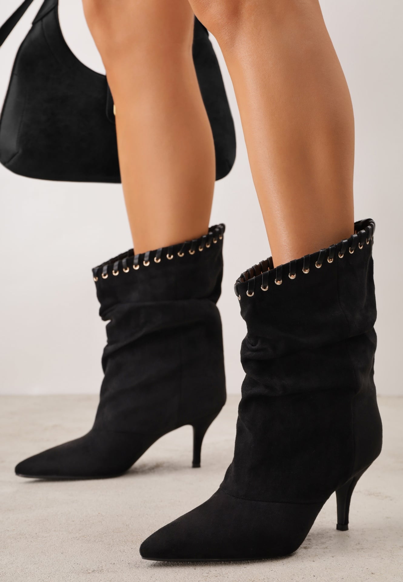 Botine Slouchy cu toc stiletto din imitație de piele întoarsă, cu ochiuri metalice decorative Tallie Negre